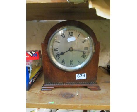 An oak mantel clock