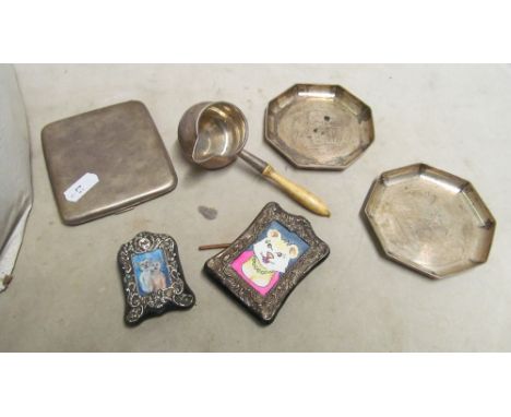 A small silver toddy ladle, two silver dishes engraved signatures, a silver cigarette case and two small frames