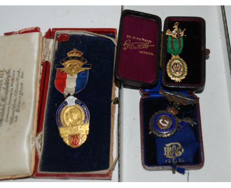 A gilt-metal and enamel coronation medallion, a gilt-metal and enamel masonic medal, white-metal example Condition Report: Av