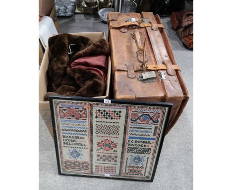 A long brown faux fur coat, a 1936 sampler, and A brown leather travel trunk printed with "Capt. A.W Chalmers" Condition Repo