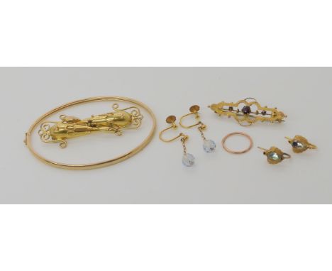 A 9ct gold bangle, a yellow metal Victorian brooch, a 9ct brooch and a collection of earrings (one single hoop earring) weigh