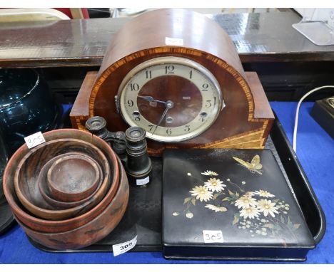 An inlaid wooden mantle clock,  assorted wooden bowls, a pair of binoculars, a black lacquer box decorated with butterflies a