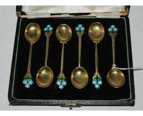 A cased set of six silver gilt and floral enamel coffee spoons Birmingham marks Condition Report: Available upon request