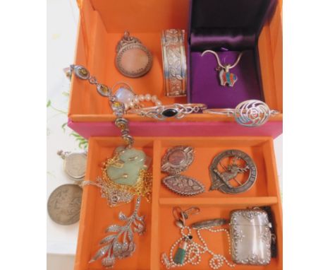 A silver vesta, a silver Victorian bangle with leaf detail, a silver medallion, a silver clan badge and other items Condition