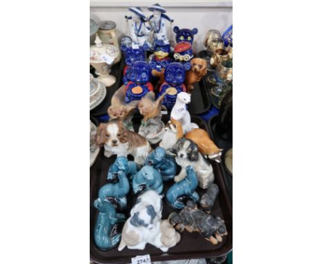 Poole pottery blue glazed models of seals, Lomonosov Russia models of raccoons a white ermine, blue glazed moneybanks in the 