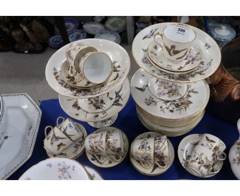 A Pirkenhammer dessert and tea service, each piece decorated with birds and insects amongst foliage, compriisng tazzas, plate