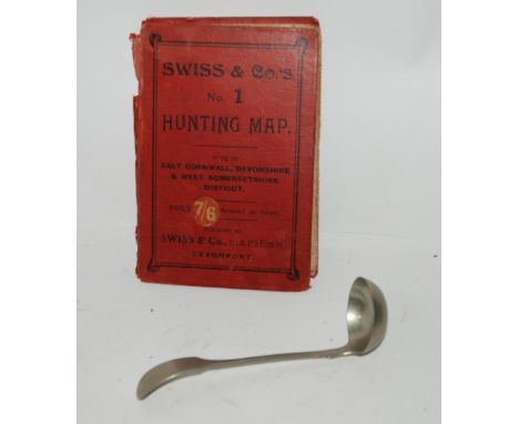 A vintage folding map and white-metal ladle Condition Report: Available upon request