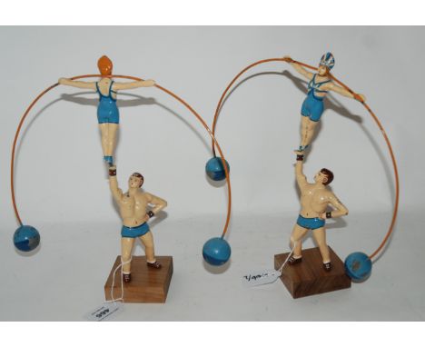 Two enamel painted balance figures (2) Condition Report: Available upon request