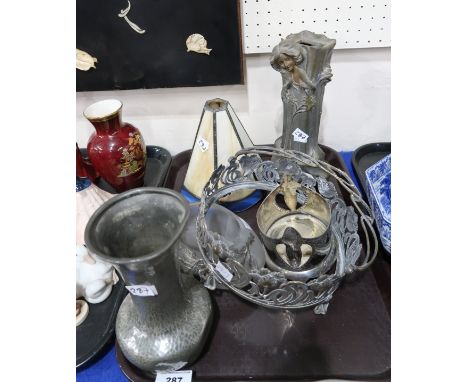 A leaded glass lamp shade, a figural brass vase depicting a female amongst foliage, a hammered pewter vase, a frosted glass t