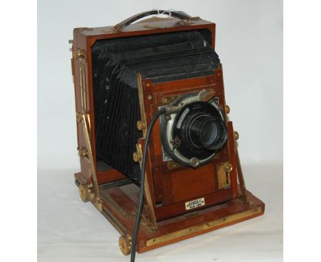 A large Gandolfi plate camera with brass fittings and bellows Condition Report: Available upon request