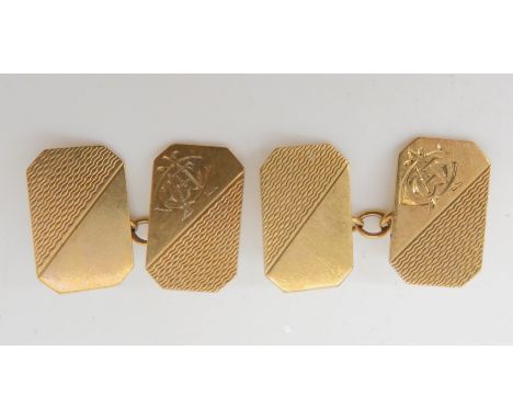 A pair of 9ct gold cufflinks with engine turned decoration and monograms weight 5.4gms Condition Report: Available upon reque