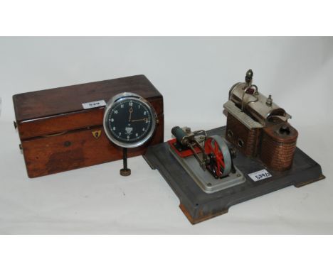 A Magneto boxed machine, German steam engine and Smiths dash clock (3) Condition Report: Available upon request
