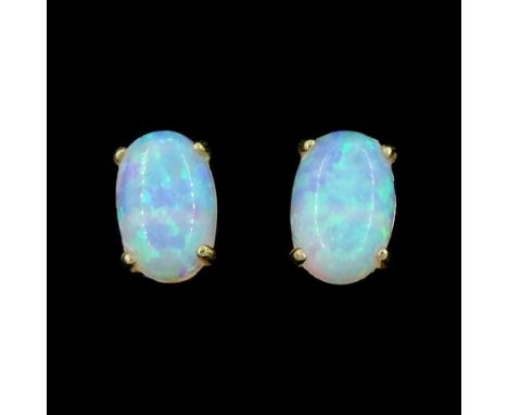 Pair of 9ct gold opal stud earringsCondition Report:Approx 0.35gm, overall head = 6mm x 4mm
