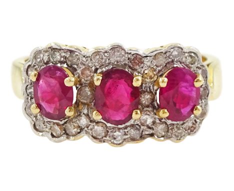 18ct gold three stone oval cut ruby and diamond cluster ring, stamped 750Condition Report:Approx 4.4gm, size M, tested 18ct, 