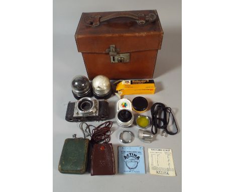 A Rectangular Leather Camera Box, the Ensign Containing Photographic Lens, Light Meter, 22cm Wide 