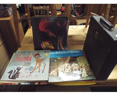 A Collection of 33rpm Records to Include Bambi, Sound of Music, Mary Poppins, Electric Light Orchestra, Status Quo