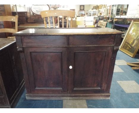 A Stained Pine Bookcase Base with Panel Doors and Two Drawers, 112cm Wide