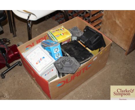 A box of various outdoor light fittings etc