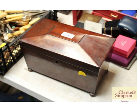 A sarcophagus shaped tea caddy
