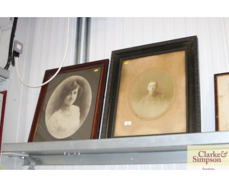 Two framed black and white portrait prints 