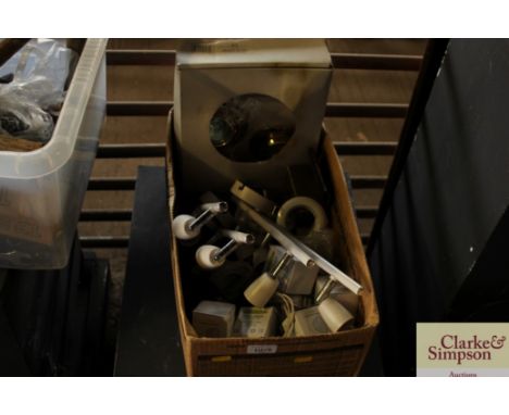 A box of various light fittings and bulbs