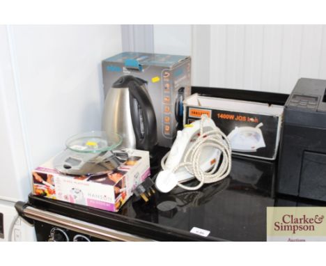 An Asda kettle, a challenge iron and a set of electric scales