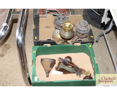 Two boxes containing tilly lamps; an oil lamp; old oil can; funnels etc
