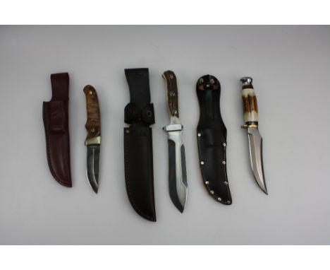 A collection of hunting knives to include Linder Trapper, Gerber River-Runner, and Schrade Pro-hunter (3)