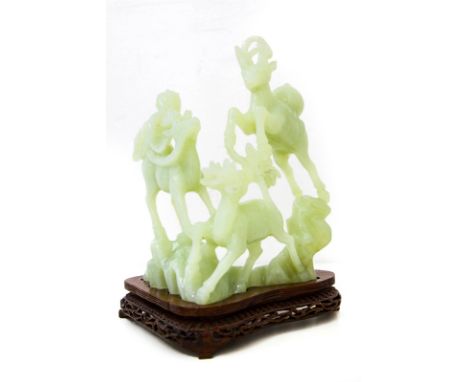 Statuette of light green jade with with wooden base. Three deer. H Cm 26 Base Cm 20.