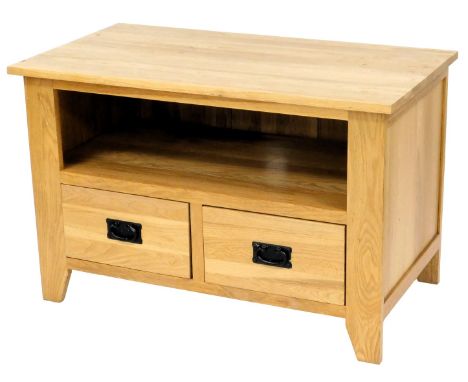 A light oak television cabinet, the rectangular top above a recess and two drawers, on stiles, 93cm wide. 