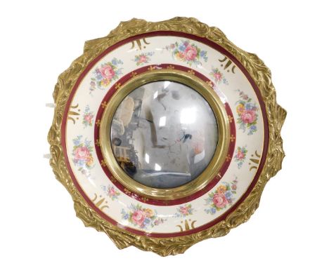 A Burleigh ware pottery and brass framed convex circular wall mirror, printed with sprays of flowers, printed marks, 38.5cm w