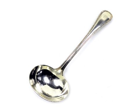 A Victorian silver cream ladle, initial engraved, London 1873, 2.40oz.