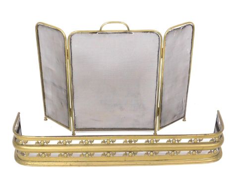 A Victorian brass and cast iron fender, 104cm wide, together with a brass and mesh three fold fire screen, 65cm high. (2) 