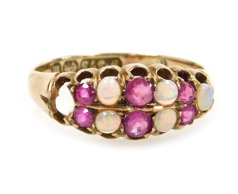 A 9ct gold opal and ruby ring, in a two row claw setting, one opal lacking, size N, 2.0g.