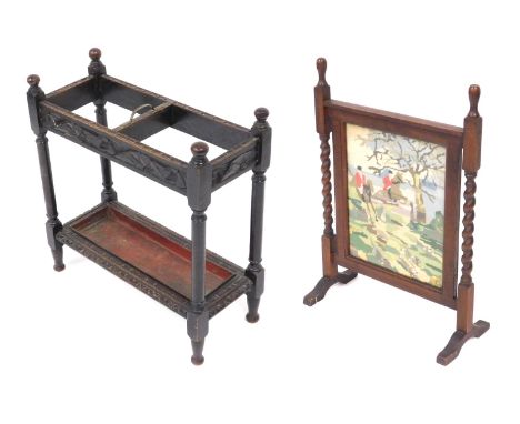 A Victorian oak umbrella and stick stand, with a brass carrying handle, with two recesses, the frame with carved decoration, 