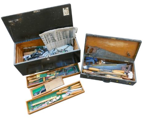 An ebonised carpenter's tool chest, the hinged lid opening to reveal assorted tools, 80cm wide, and a further chest enclosing
