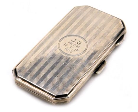 A George V silver cigarette case, of canted rectangular form, with engine turned decoration, circular reserve engraved J.G. f