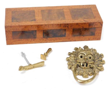 A satinwood and burl walnut glove box, 28.5cm wide, together with a brass copy of the Sanctuary Ring door knocker at Durham c