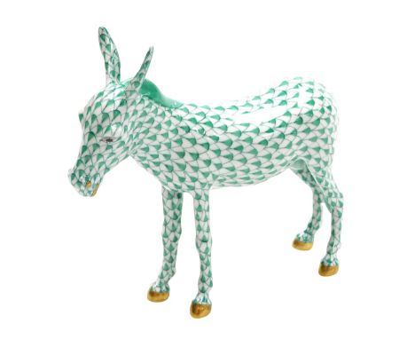 A Herend porcelain figure of a donkey, with a green scale ground, painted marks, 18cm wide.