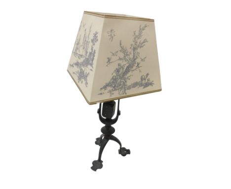 A Victorian Arts and Crafts cast iron gimbal table lamp, with a later shade, 48.5cm high.