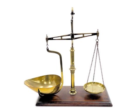 A set of Victorian brass balance scales, by Parnall &amp; Sons of Bristol, raised on a mahogany base, 60cm high.