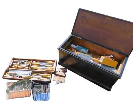 An ebonised carpenter's tool chest, with a hinged lid opening to reveal assorted carpenter's tools, etc, 89cm wide.