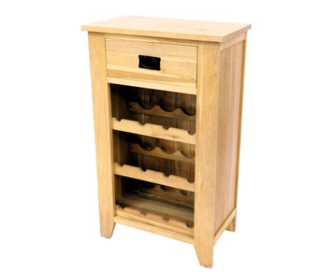 A light oak kitchen wine rack, with a frieze drawer above three section rack, on stiles, 101cm high, 50cm wide.