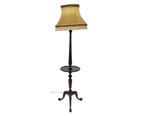 An Edwardian mahogany standard lamp table, with shade, on a fluted and leaf carved column, with central circular table, raise