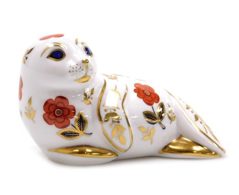 A Royal Crown Derby Imari paperweight modelled as a seal pup, gold stopper, 12cm wide.