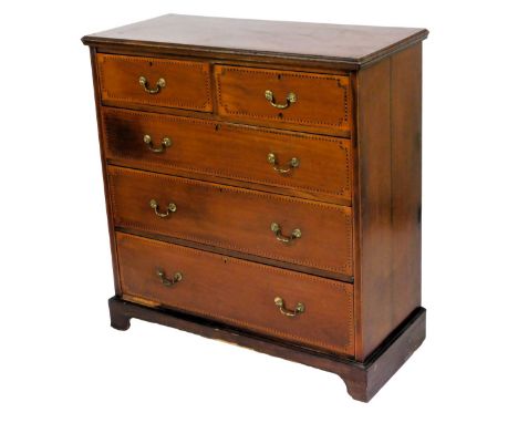 An Edwardian mahogany chest, of two short and three long graduated drawers, with herringbone banding, brass swan neck handles