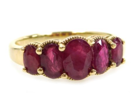 A ruby five stone ring, possibly Burmese, of graduated size, set in unmarked yellow metal, size P, 2.9g.