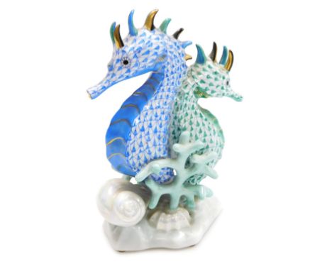 A Herend porcelain figure group of a pair of seahorses, blue and green scale ground, on a naturalistic base with lustre seash