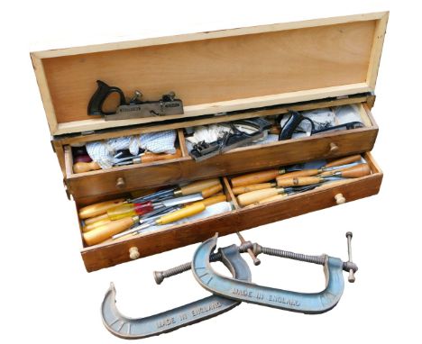 A carpenter's pine tool chest, the hinged front opening to reveal two drawers, enclosing tools, 87cm wide, and a pair of Reco