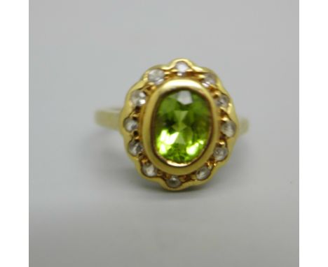 A 9ct gold, peridot and white stone cluster ring, 2.1g, K 